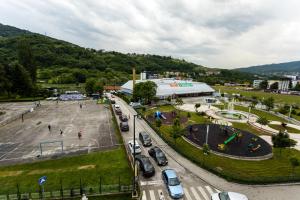 a city with cars parked in a parking lot at Urban Escape in Vogošća