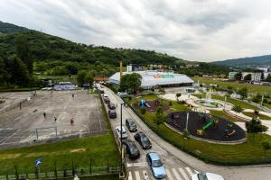 a city with cars parked in a parking lot at Urban Escape in Vogošća