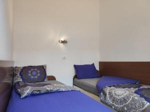 Posteľ alebo postele v izbe v ubytovaní Lavanda apartment