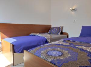 Posteľ alebo postele v izbe v ubytovaní Lavanda apartment
