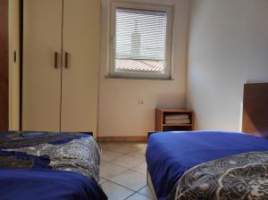 Posteľ alebo postele v izbe v ubytovaní Lavanda apartment