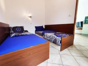 Posteľ alebo postele v izbe v ubytovaní Lavanda apartment