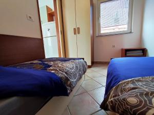 Posteľ alebo postele v izbe v ubytovaní Lavanda apartment