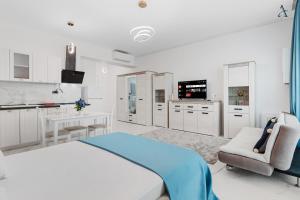 a hospital room with a bed and a kitchen at RentForComfort Saint George Studio & Sea View in Mamaia
