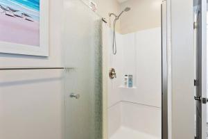 a shower with a glass door in a bathroom at 33rd Unit 2 Catch some rays Parking Beach 2 Blocks Away in Brigantine
