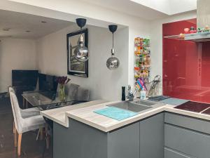 a kitchen with two sinks and a counter top at The Studio in Wingham