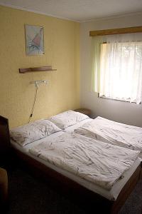 Postel nebo postele na pokoji v ubytování Hotel-Penzion Johanka