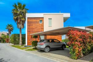 a car parked in front of a house at Aegean Sea View Villa in Pefkochori