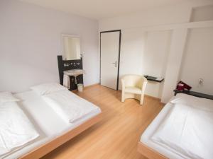 Ένα ή περισσότερα κρεβάτια σε δωμάτιο στο Hotel Gregory