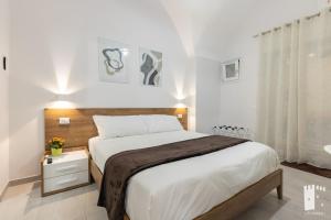 A bed or beds in a room at La Torre 31