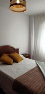 Posteľ alebo postele v izbe v ubytovaní Apartamento Mercedes Quenxe Corcubión