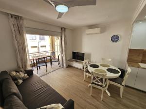 a living room with a couch and a table at HDA apartment 2. in Torrevieja