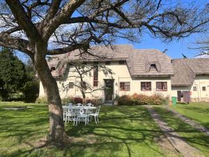 a table and chairs in front of a house at Monte Video-Deo Gloria in Champagne Valley +49 photos