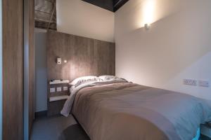a bedroom with a large bed in a room at Harbour Haven Maisonette in Kalkara