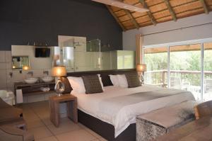 Ένα ή περισσότερα κρεβάτια σε δωμάτιο στο Highveld Splendour Boutique Bed and Breakfast