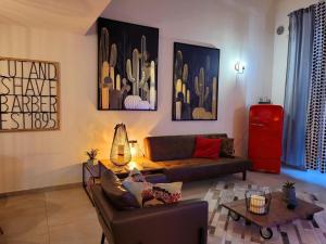 a living room with a couch and a table at INDUSTRY HOME in Catania