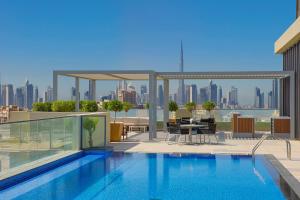 a swimming pool on the roof of a building at Element by Marriott Al Jaddaf, Dubai in Dubai