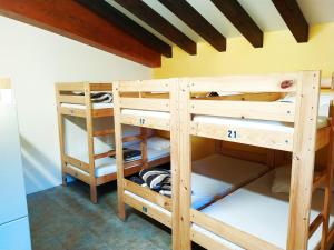 a room with two bunk beds in a room at Amaiurko Aterpea in Maya del Baztán