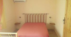 Katil atau katil-katil dalam bilik di Villa Panoramica Capitana
