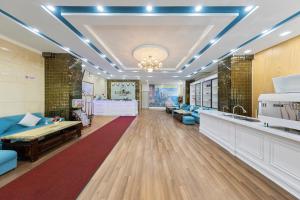 a lobby with a waiting room with blue furniture at Blue Pearl Hotel in Nha Trang