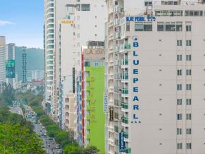 a group of tall buildings in a city at Blue Pearl Hotel in Nha Trang