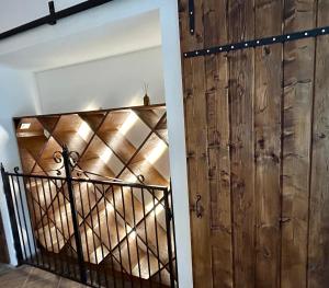 a room with a wooden door and a stairway at Wine Paradise in Sveti Ivan Zelina