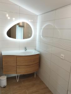 a bathroom with a sink and a mirror at Le Spa panoramique du plateau in Valensole