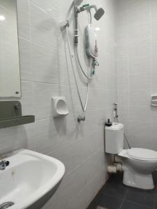 a bathroom with a shower and a toilet and a sink at KAF Homestay for Musliim only with Pool, 3 Bedroom, Smartkey concept, Kids Trampoline, Game console, WIFI, Durioo in Perai