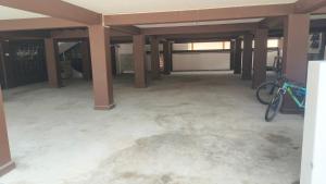 an empty garage with a bike parked in the middle at MOCAHM in Shillong