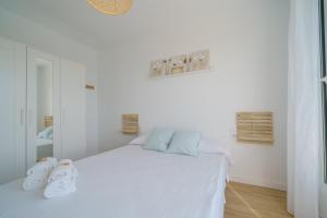 Postel nebo postele na pokoji v ubytování HomeHolidaysRentals Delmare - Costa Barcelona