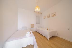 Postel nebo postele na pokoji v ubytování HomeHolidaysRentals Delmare - Costa Barcelona