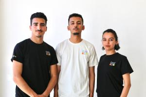 a group of three men standing next to each other at TigMAÏA Guest House In Agadir for Traditional Art and Culture in Agadir