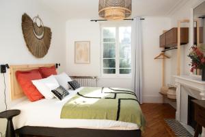 Katil atau katil-katil dalam bilik di Villa L'Anse - 1er étage