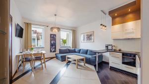 Kuchyňa alebo kuchynka v ubytovaní Apartamenty Sun & Snow Willa Park
