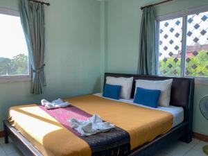 Säng eller sängar i ett rum på Mixay Paradise Hotel