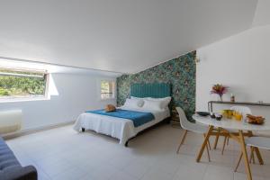 Een bed of bedden in een kamer bij Hôtel & Résidence San Roccu