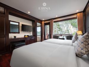 a bedroom with two white beds and a window at Erina Cruise by HAG in Ha Long +76 photos