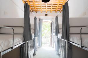 a bus with two beds in the hallway at HOSTEL PRIME in Benicàssim