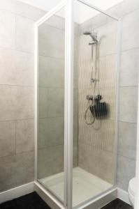 a shower with a glass door in a bathroom at The Lakeside in Redcar