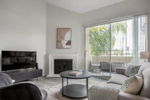 a living room with a couch and a table at Century City 2br w bbq wd nr mall shops LAX-1063 in Los Angeles