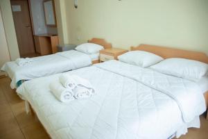 Postel nebo postele na pokoji v ubytování Hotel Oaz