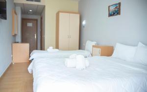 Postel nebo postele na pokoji v ubytování Hotel Oaz