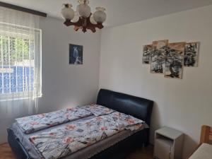 Posteľ alebo postele v izbe v ubytovaní reginavendeghaz
