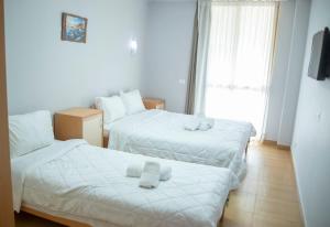 Postel nebo postele na pokoji v ubytování Hotel Oaz + 34 fotografií