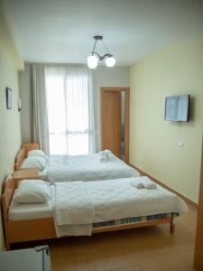 Postel nebo postele na pokoji v ubytování Hotel Oaz