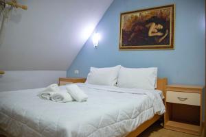 Postel nebo postele na pokoji v ubytování Hotel Oaz