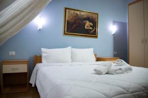 Postel nebo postele na pokoji v ubytování Hotel Oaz