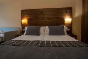 Postel nebo postele na pokoji v ubytování Hotel Màgic Ski