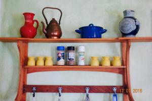 a wooden shelf with bottles and vases on it at Ferienhaus Wagner in Bernkastel-Kues +42 photos