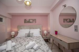 Ένα ή περισσότερα κρεβάτια σε δωμάτιο στο Hypatia Suites by "elite"